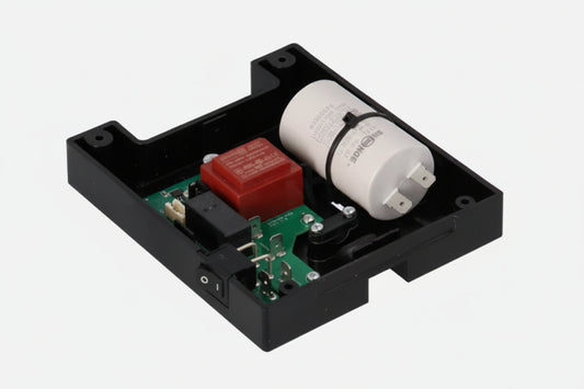 Eureka Mignon Classico and Specialità 220V base assembly kit showing PCB control board, red transformer, motor capacitor, power switch, and black plastic housing